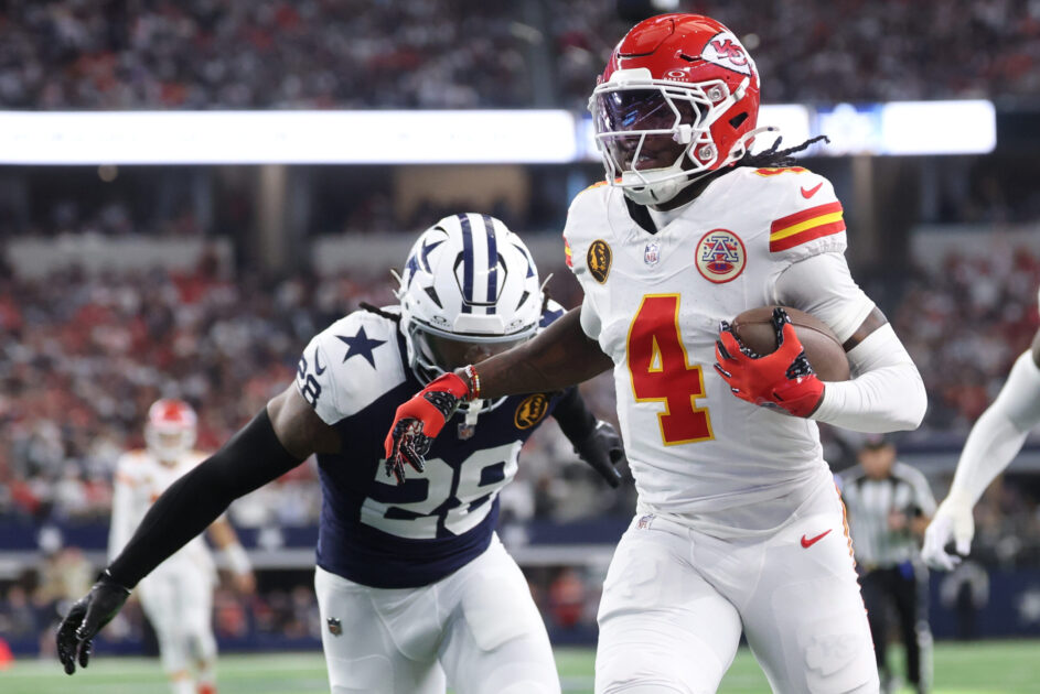 Nov 27, 2025; Arlington, Texas, USA; Kansas City Chiefs wide receiver Rashee Rice (4) runs with the ball past Dallas Cowboys safety Malik Hooker (28) during the first quarter at AT&T Stadium. Mandatory Credit: Kevin Jairaj-Imagn Images