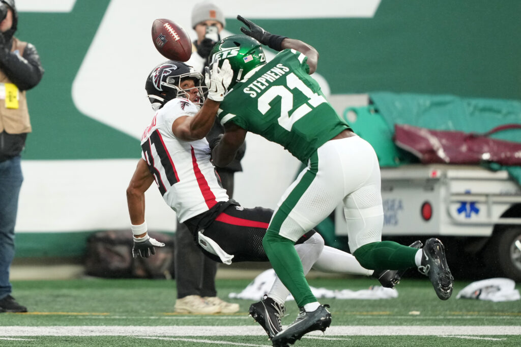 Nov 13, 2025; Foxborough, Massachusetts, USA; New York Jets cornerback Brandon Stephens (21) tackles New England Patriots wide receiver Demario Douglas (3) in the first quarter at Gillette Stadium. Mandatory Credit: David Butler II-Imagn Images