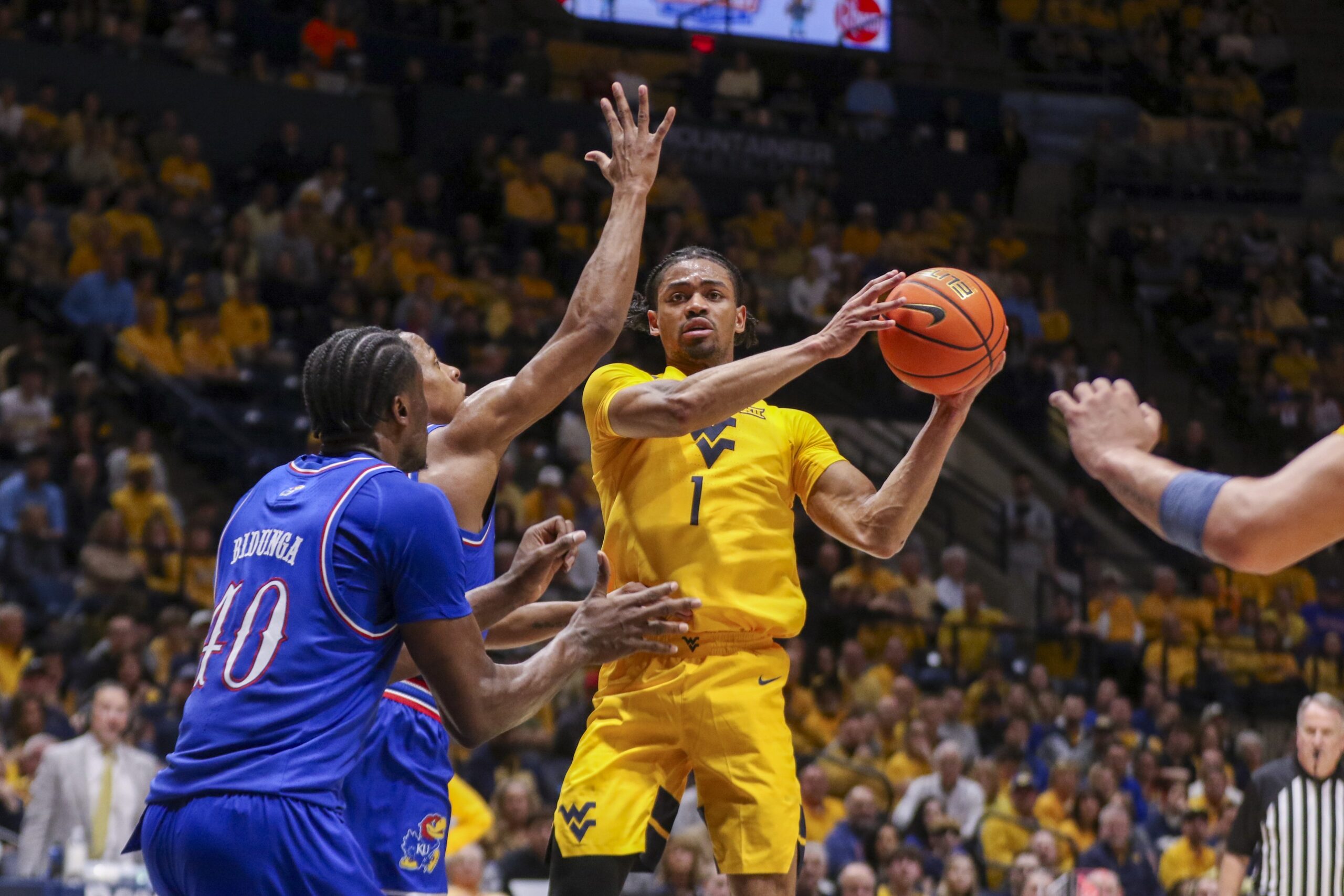 West Virginia cleans up mistakes, efficient in Kansas win
