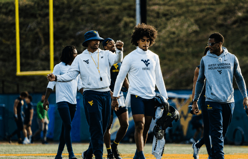Michael Hawkins is learning plenty from WVU legend Pat White