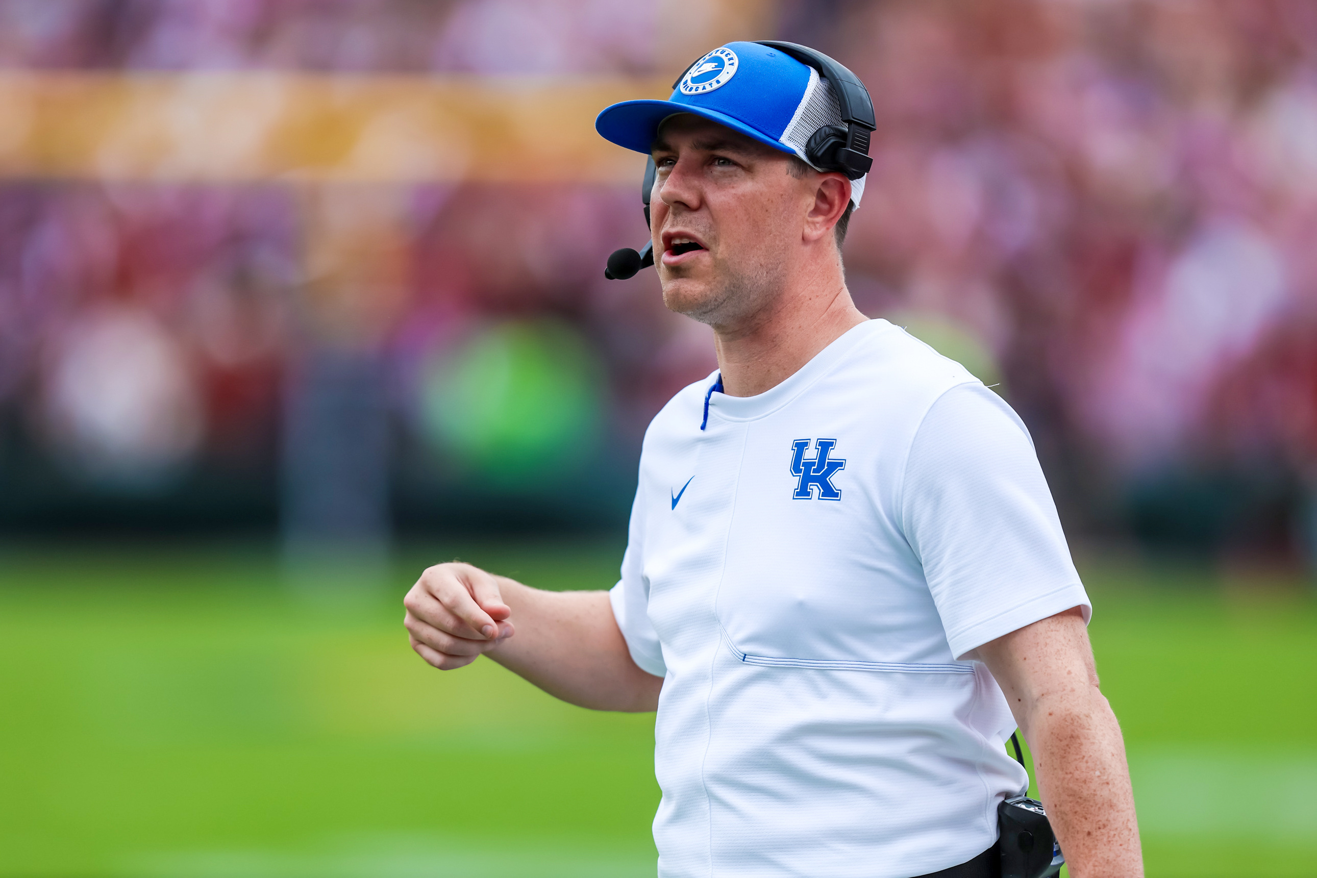 Kentucky head coach Will Stein wearing a headset and Wildcats cap against South Carolina on October 3 2026