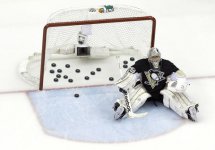 MAF Pucks behind him.jpg