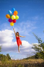 usa-texas-young-woman-flying-with-balloons-ABAF000391.jpg