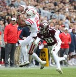 Ole Miss White Uniform with Red Stripes.jpg