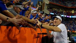 University-of-Florida-head-coach-Dan-Mullen-does-a-victory-lap-around-Ben-Hill-Griffin-Stadium...jpg